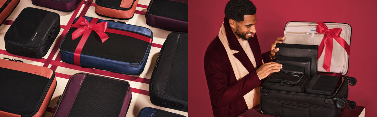 A man in a burgundy blazer and cream scarf opens a black suitcase with a large red ribbon bow, while a split view on the left shows multiple travel bags in assorted colors and sizes arranged on a red-and-white plaid surface.