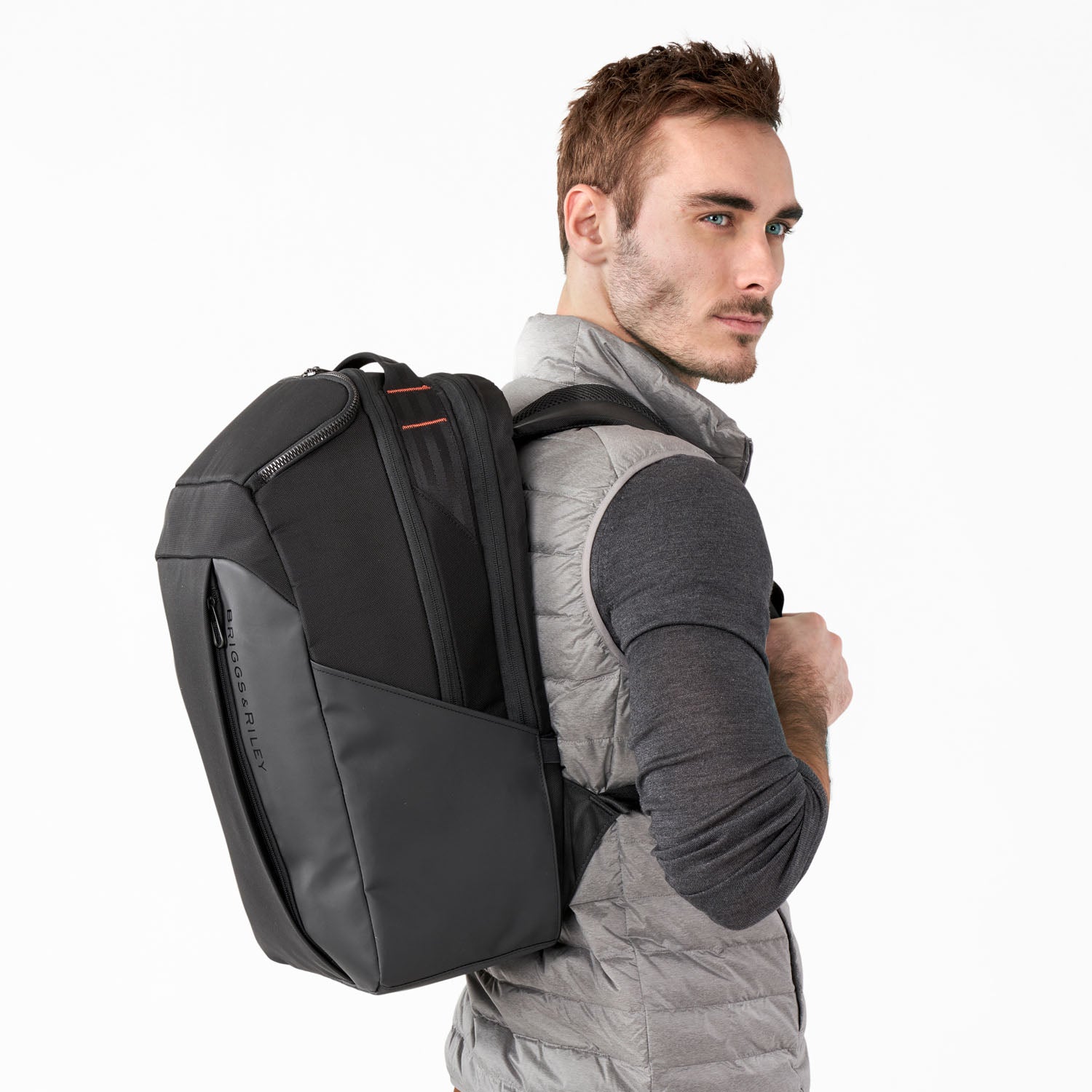 Briggs and Riley ZDX Cargo Backpack On Person side view